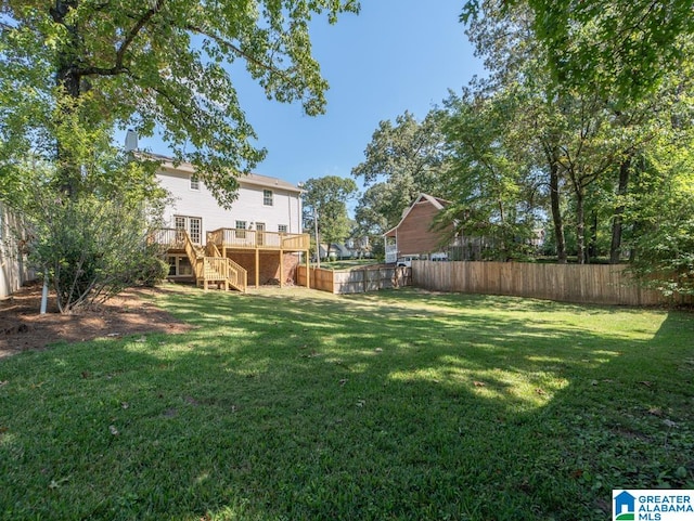 view of yard featuring a wooden deck