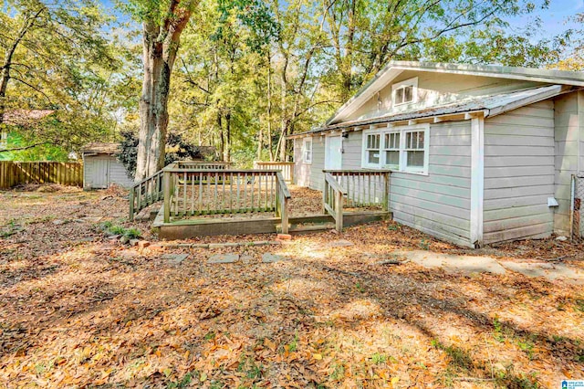 exterior space featuring a shed and a deck