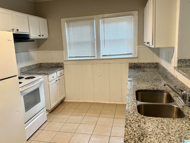 kitchen with white appliances, extractor fan, white cabinetry, and sink