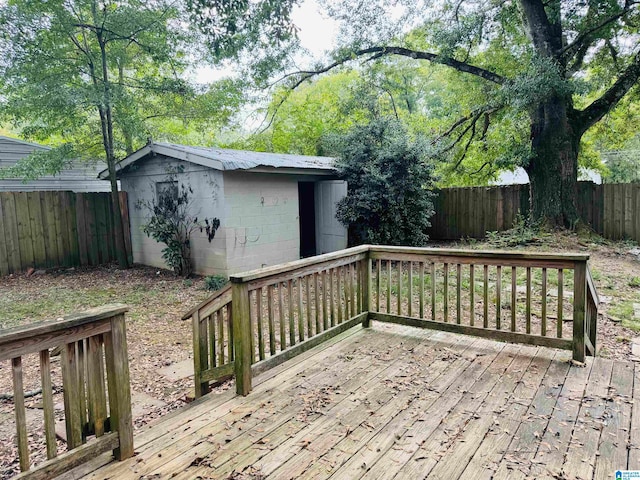 wooden deck featuring a storage shed