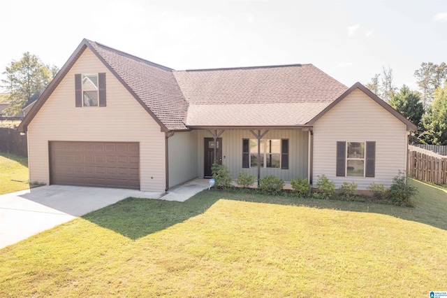 view of front of home with a garage and a front lawn