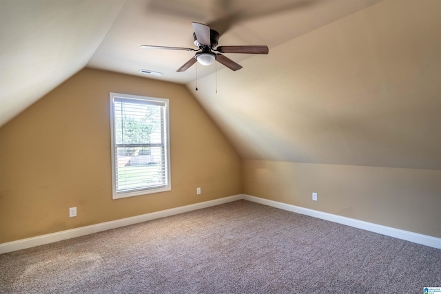 additional living space featuring ceiling fan, carpet, and vaulted ceiling