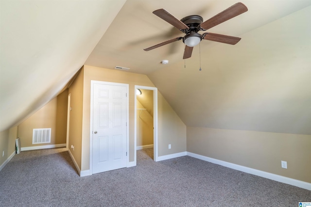 additional living space featuring ceiling fan, carpet floors, and vaulted ceiling