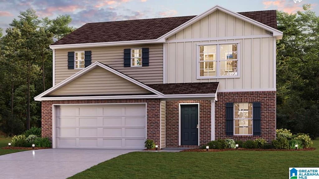 view of front of property with a lawn and a garage