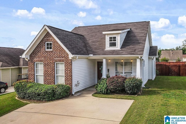 new england style home featuring a front lawn