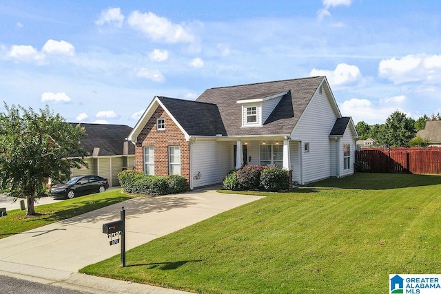 cape cod house featuring a front lawn