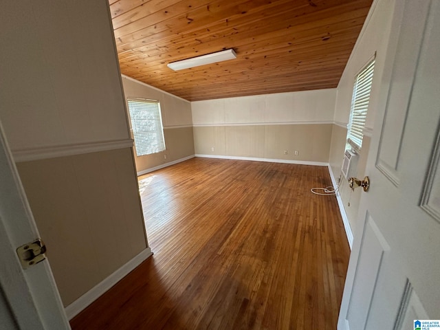 additional living space featuring wooden ceiling, wood-type flooring, and vaulted ceiling