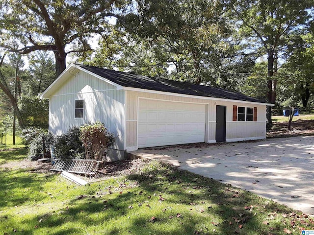 garage featuring a yard