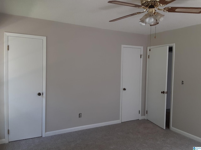 unfurnished bedroom featuring carpet and ceiling fan