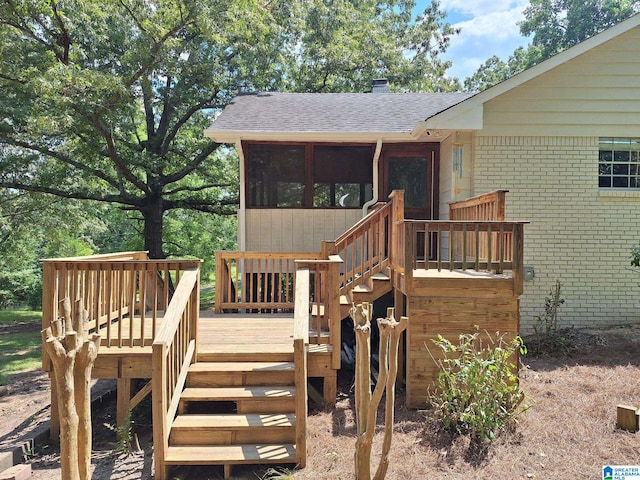 wooden deck featuring a sunroom