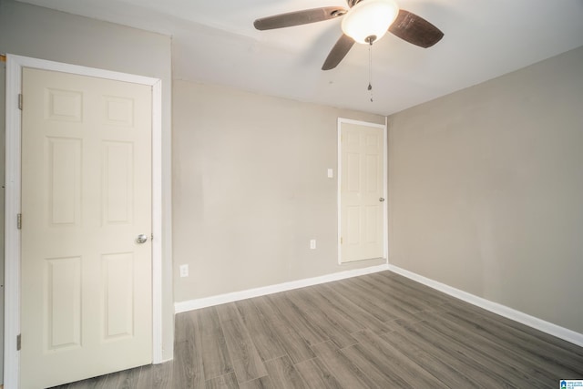 spare room with wood-type flooring and ceiling fan