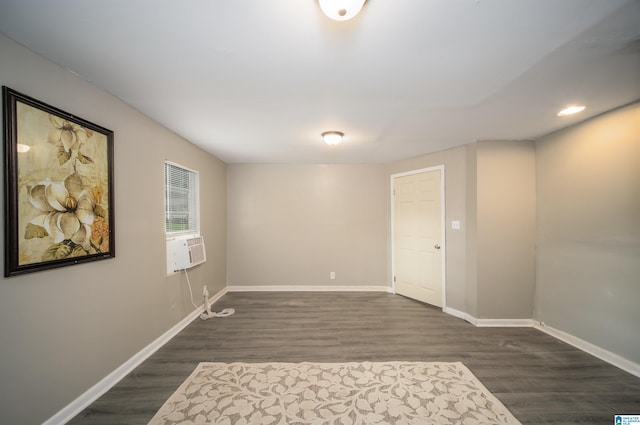 unfurnished room with dark hardwood / wood-style floors