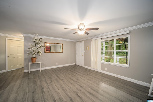 empty room with ornamental molding, ceiling fan, and dark hardwood / wood-style floors