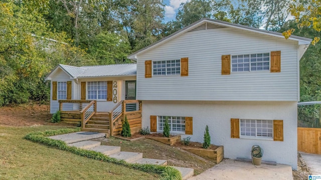 split level home with a front yard