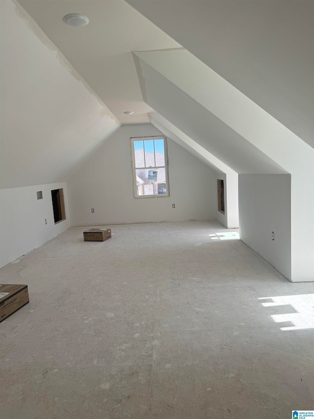 additional living space with vaulted ceiling