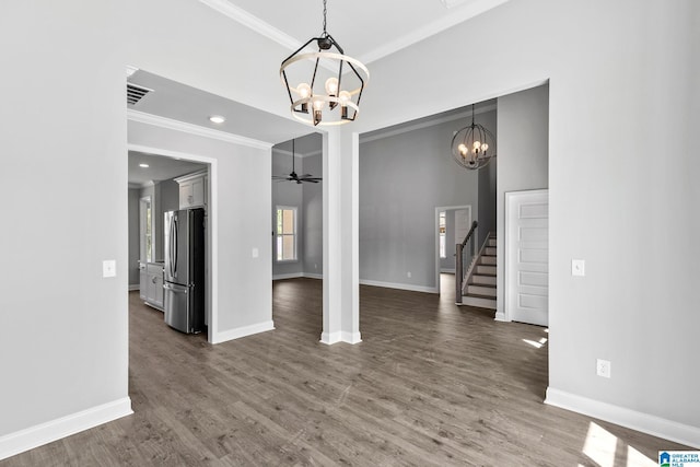interior space featuring stairway, visible vents, baseboards, and ornamental molding