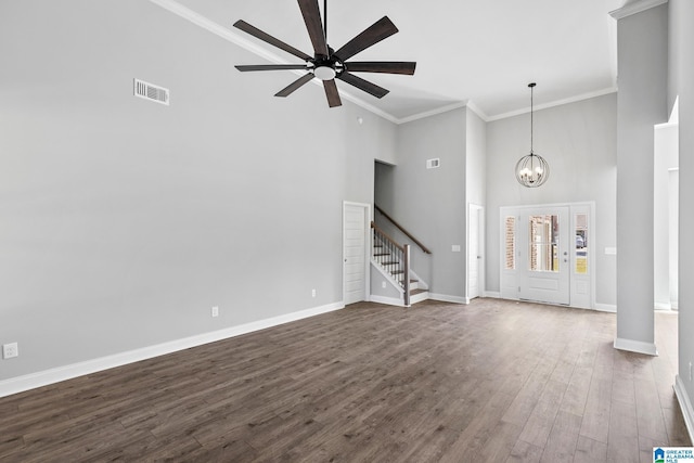 unfurnished living room featuring crown molding, stairs, visible vents, high vaulted ceiling, and ceiling fan with notable chandelier