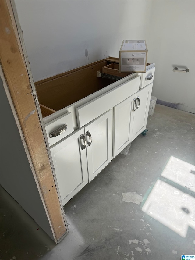 bathroom with concrete flooring