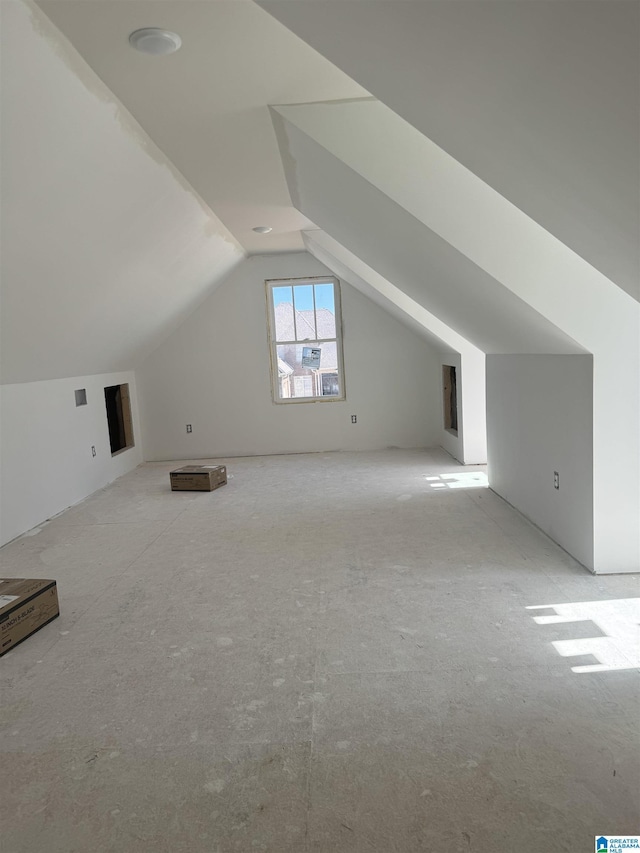 bonus room featuring vaulted ceiling