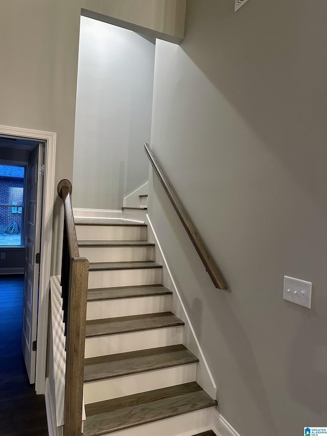 stairway with wood-type flooring