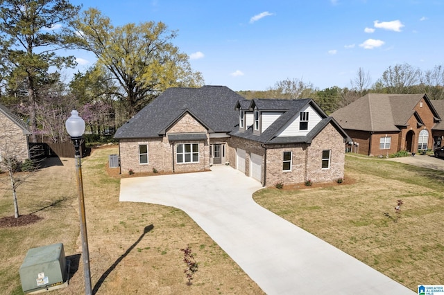 view of front of home featuring driveway, a front lawn, brick siding, a garage, and a shingled roof