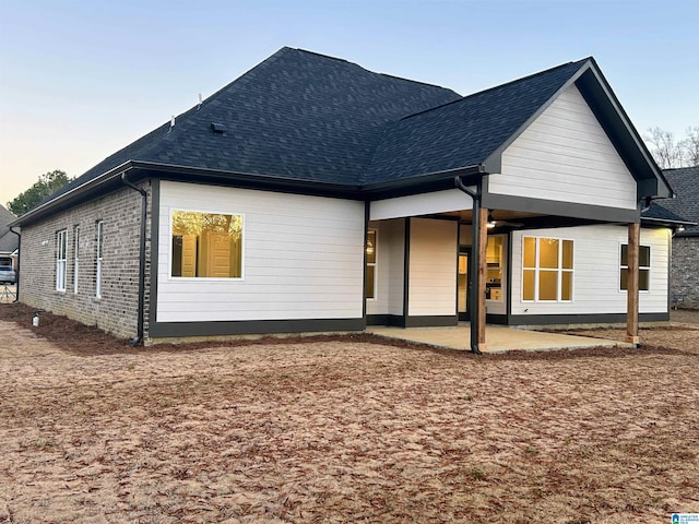 back of house with a patio