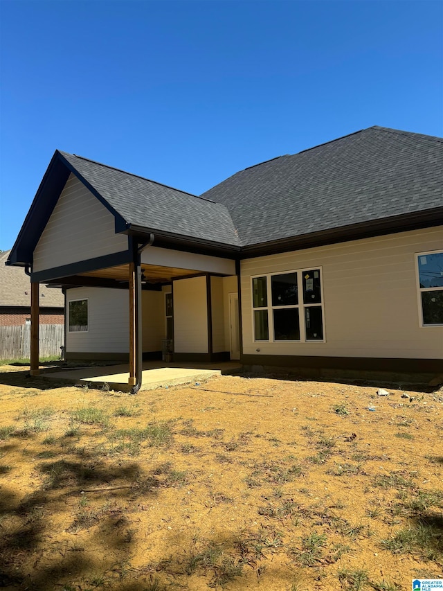 back of house with a patio