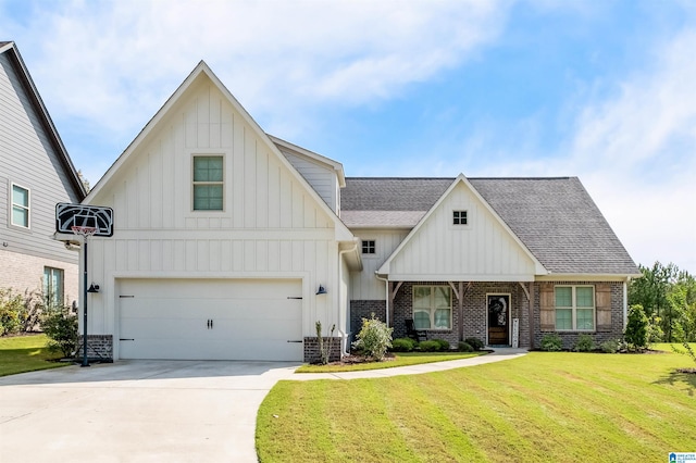 view of front of home with a garage and a front lawn