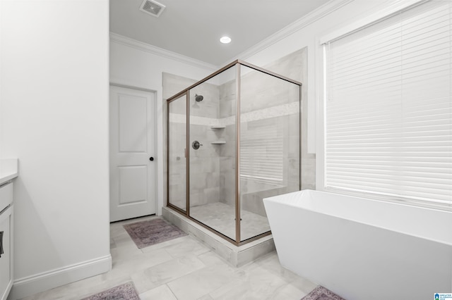 bathroom featuring ornamental molding, vanity, and separate shower and tub