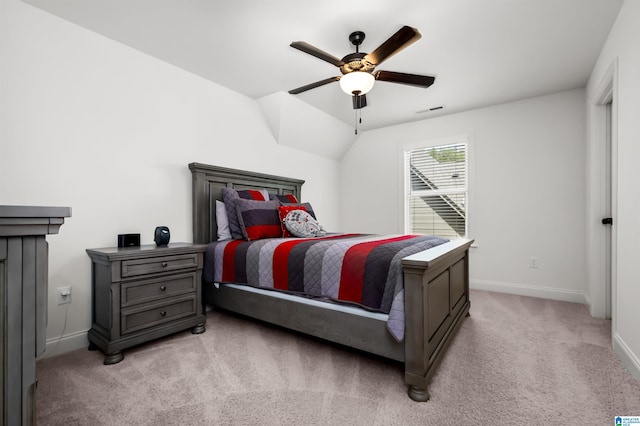 carpeted bedroom with lofted ceiling and ceiling fan