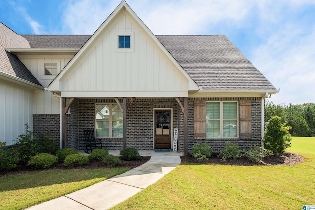 view of front of house featuring a front lawn and a porch