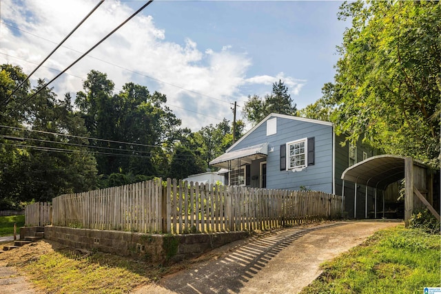 view of home's exterior with a carport