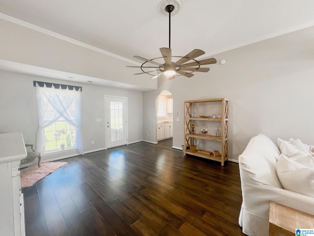 sitting room with ceiling fan, dark hardwood / wood-style floors, and ornamental molding