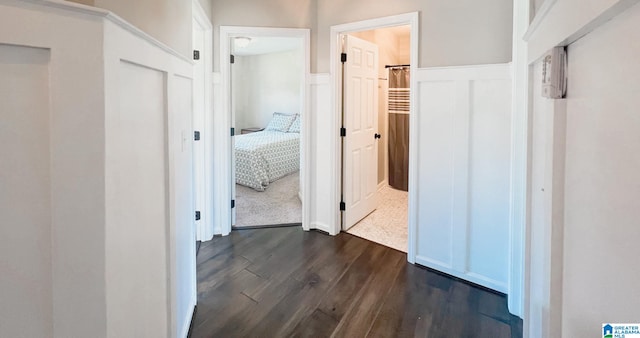 corridor featuring dark hardwood / wood-style floors