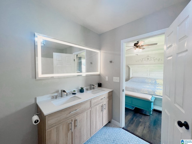 bathroom with ceiling fan, hardwood / wood-style flooring, and vanity