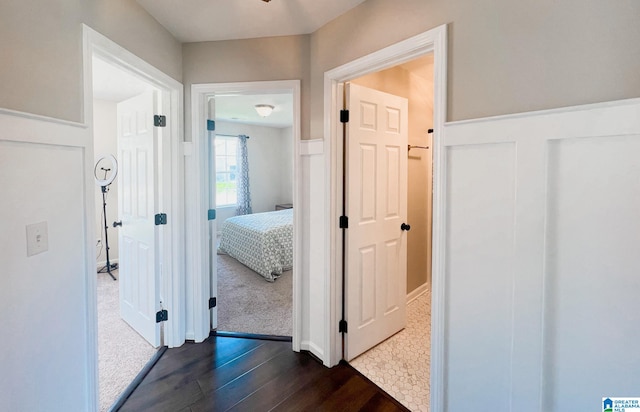 corridor featuring dark hardwood / wood-style floors