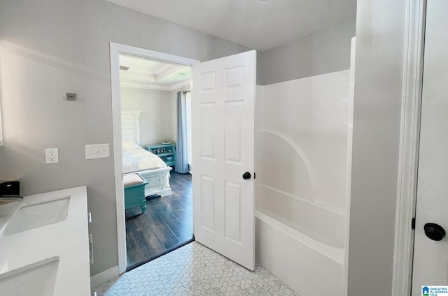 bathroom with ornamental molding, separate shower and tub, hardwood / wood-style floors, and sink