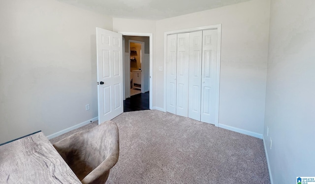 unfurnished bedroom featuring carpet and a closet