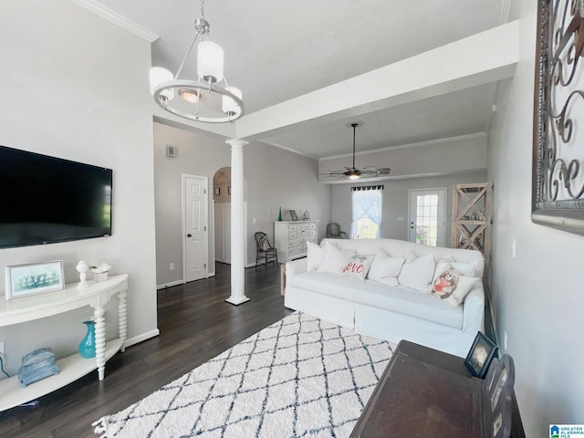 living room with ornamental molding, ceiling fan with notable chandelier, dark hardwood / wood-style floors, and ornate columns