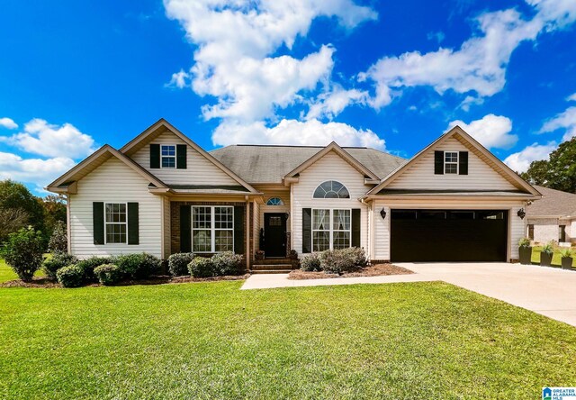 view of front facade featuring a front yard and a garage