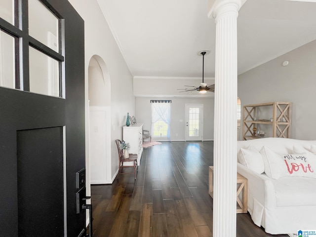 foyer with crown molding, dark hardwood / wood-style floors, ceiling fan, and ornate columns