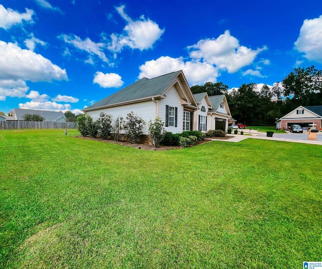 view of property exterior with a garage and a yard