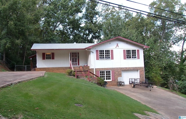 view of front facade with a front yard and a garage