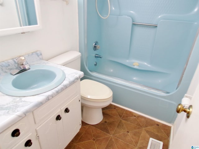 full bathroom with tile patterned flooring, toilet, vanity, and bath / shower combo with glass door