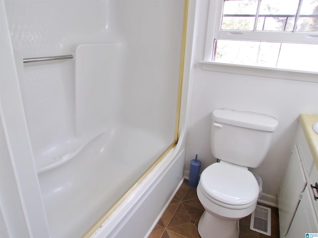 full bathroom with shower / tub combination, tile patterned flooring, vanity, and toilet