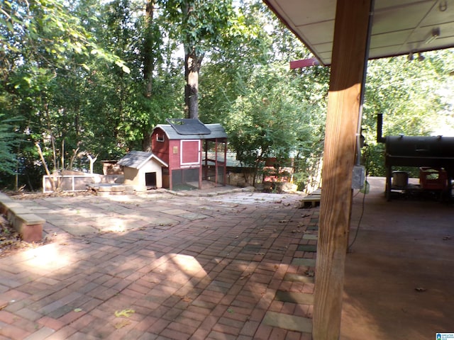 view of patio / terrace with a storage unit