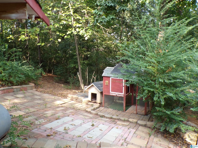 view of patio / terrace with an outdoor structure