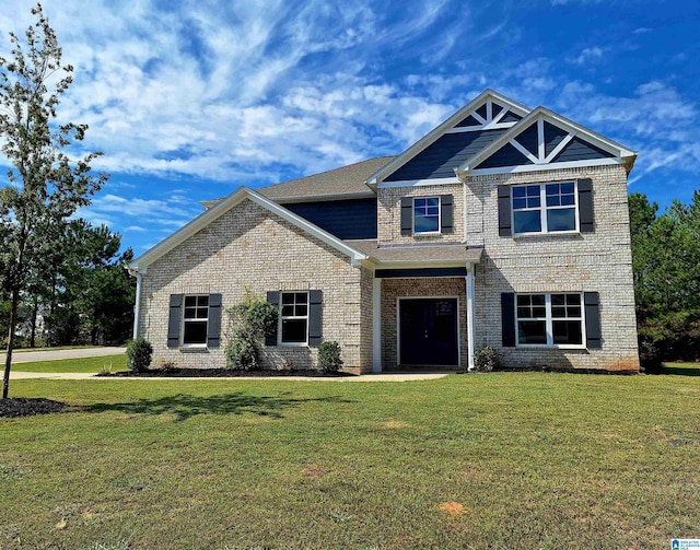 craftsman-style house featuring a front yard