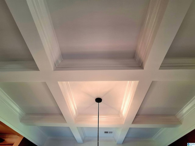 details with coffered ceiling, beamed ceiling, and ornamental molding