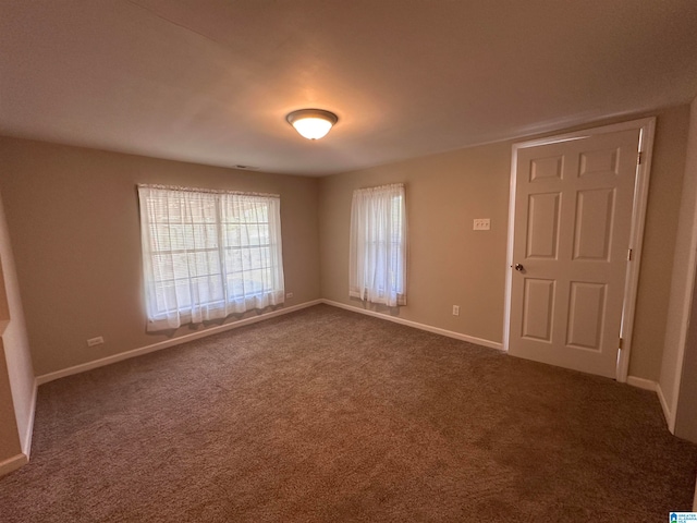 empty room with carpet flooring